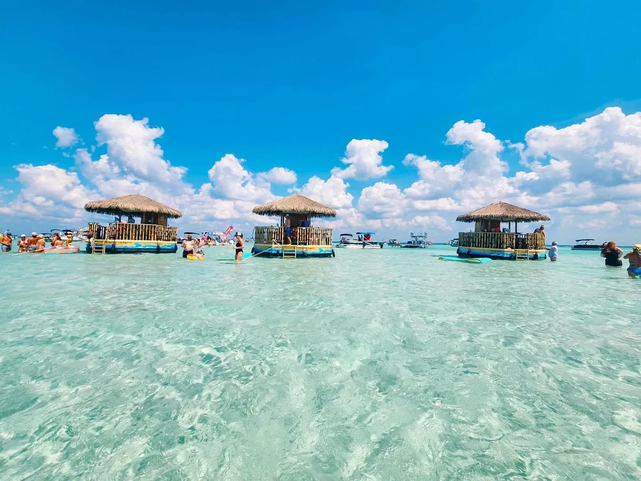 Tropical huts in crystal clear sea