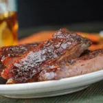 Juicy ribs served with iced beverage