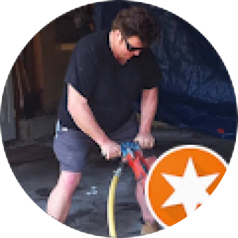 Individual working with construction tool