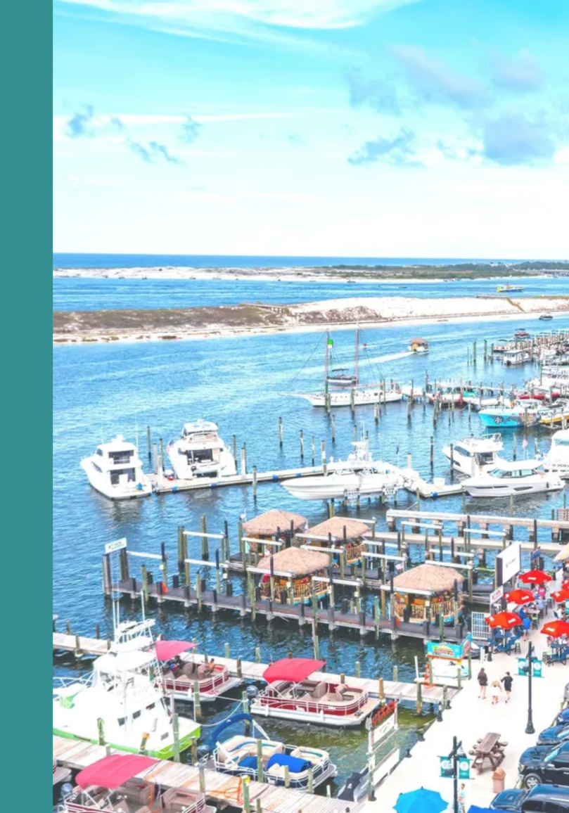 Coastal marina with boats and buildings
